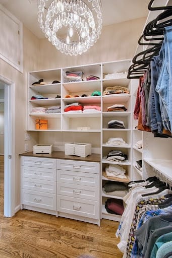 closet with custom shelving built in for enhanced storage