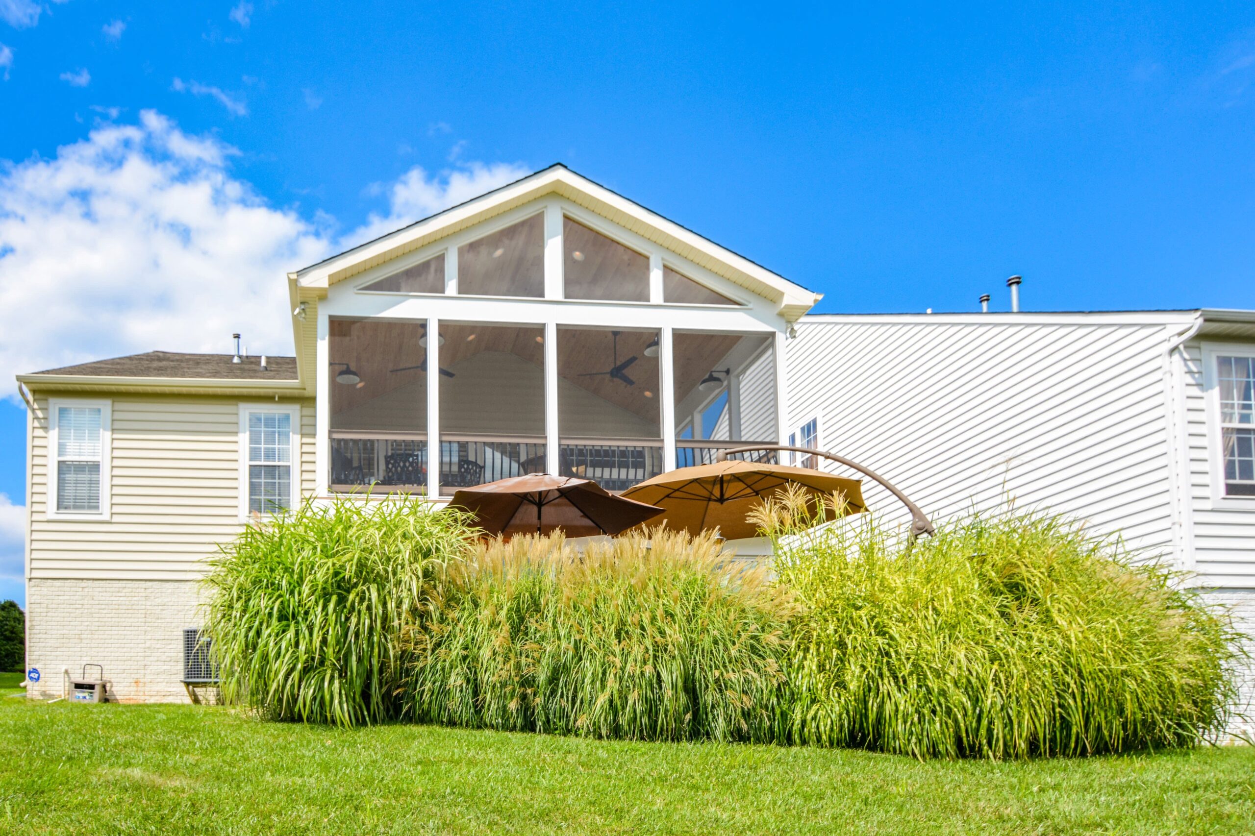 Backyard view of a spacious covered porch
