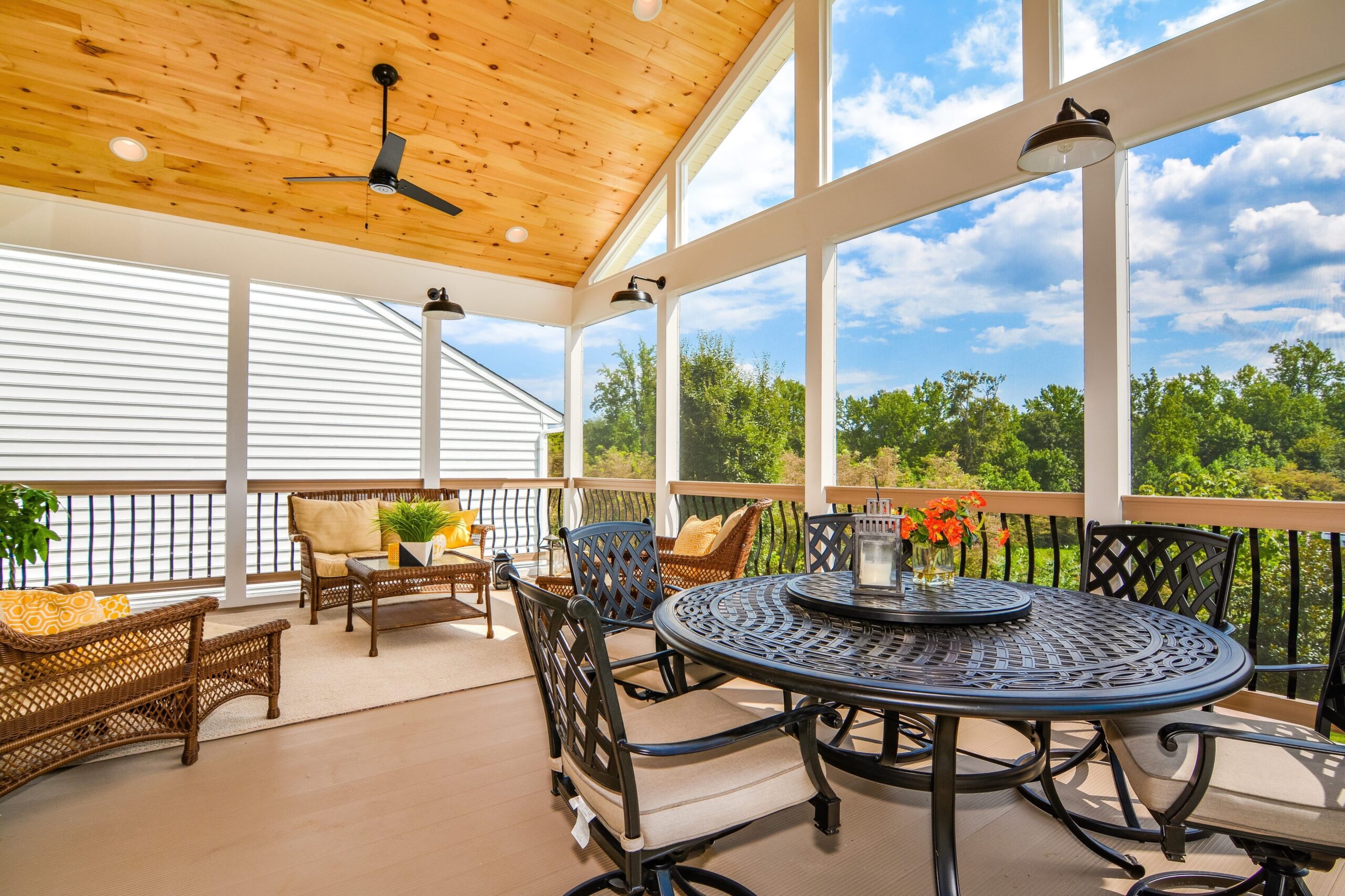 Covered porch designed for comfortable outdoor living spaces with scenic backyard views