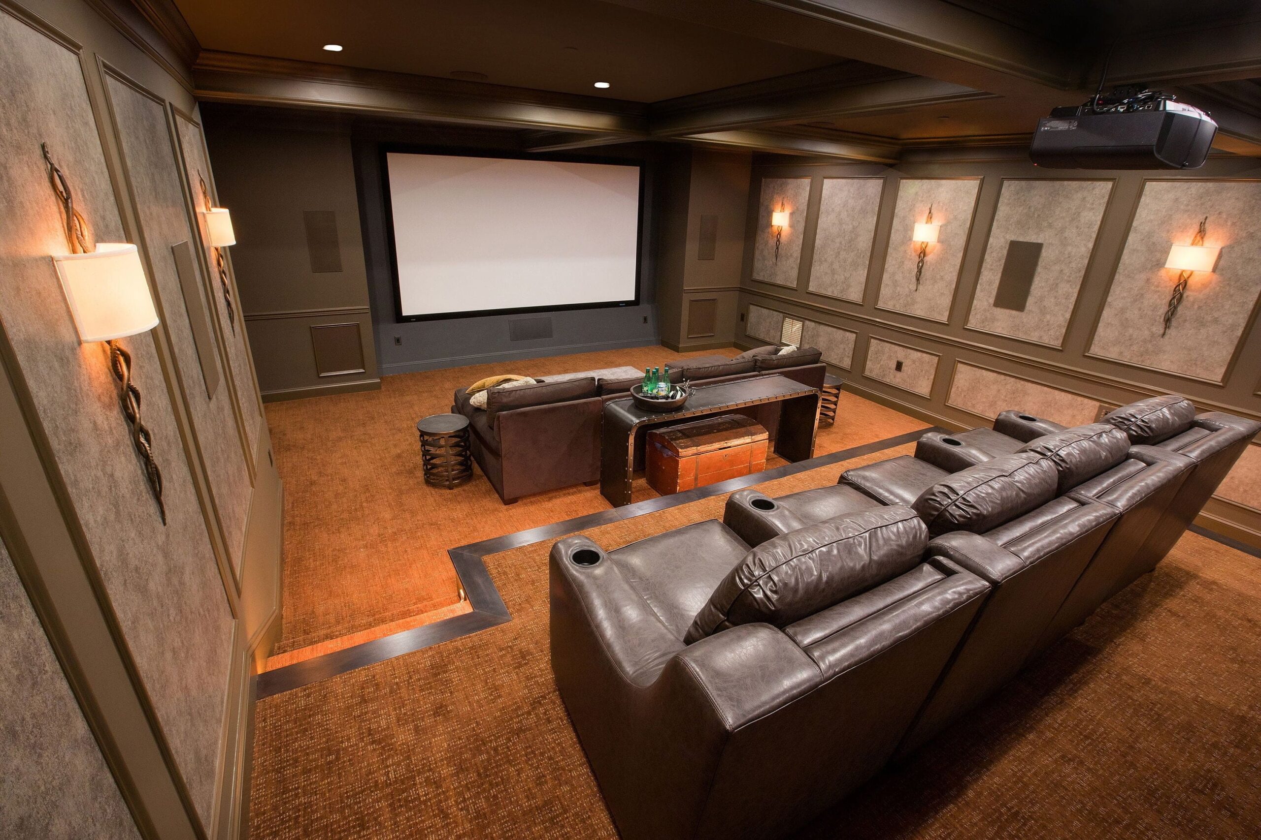 Maryland basement transformed into a specialty home theater project with cozy sectional seating and projector setup