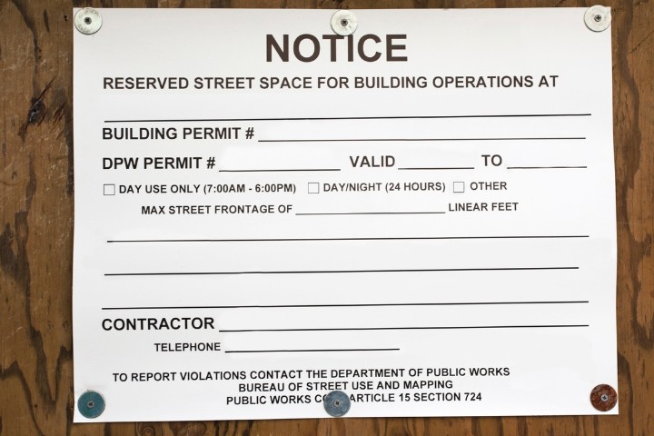 Blank Construction notice sign representing permit approval for home addition