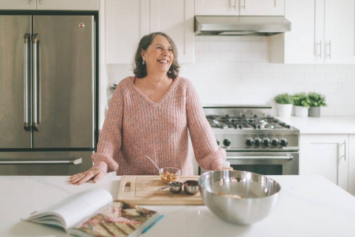 Happy homeowner with beautiful kitchen transformation