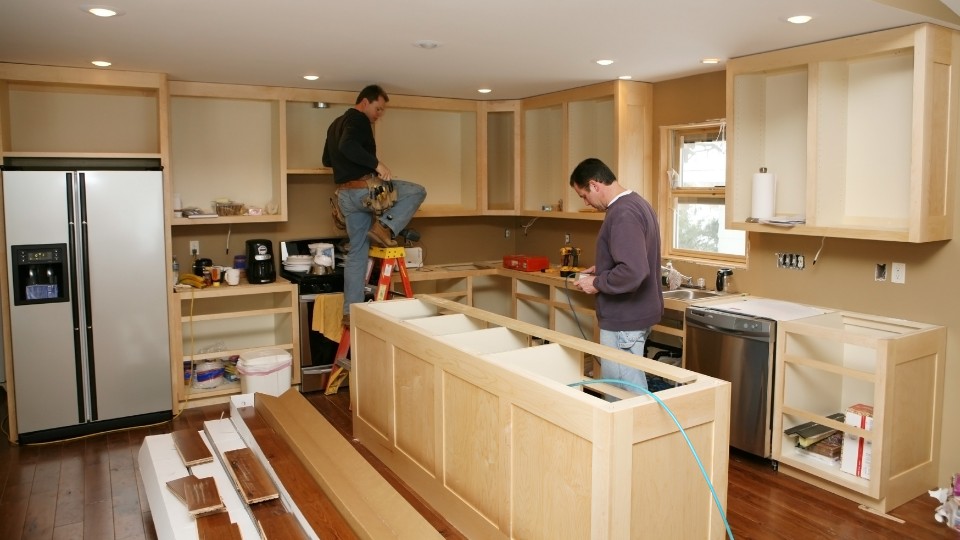 Ongoing kitchen renovation with island and cabinetry updates