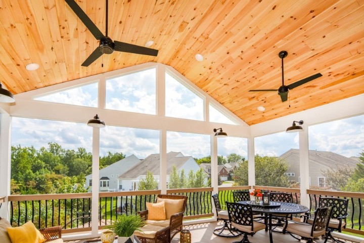 Cozy Maryland porch enclosed with screens and wood ceiling