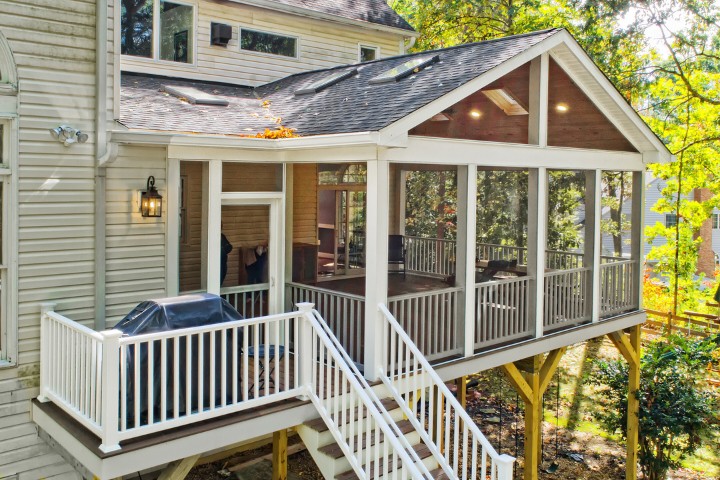 Exterior view of home enhanced by a screened porch home addition