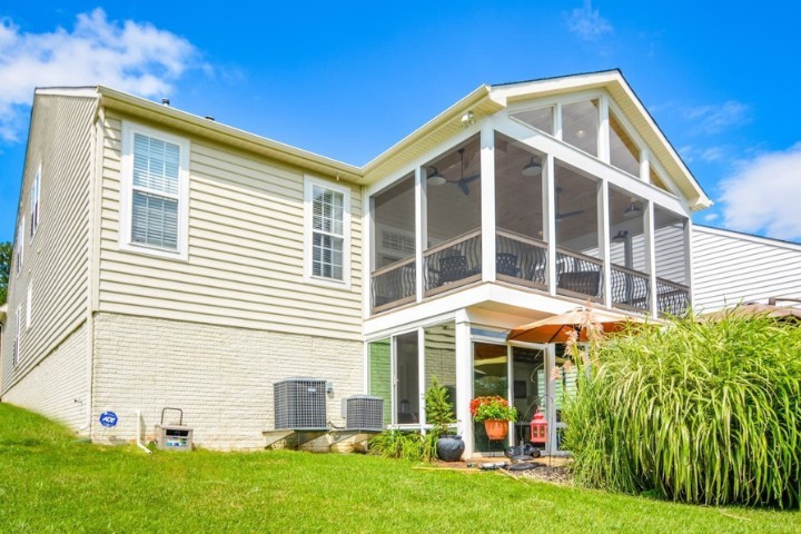 Maryland home addition showcasing multiple rooms and second story porch sunroom