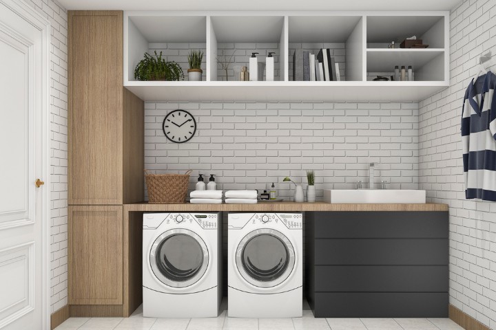 Garage turned into stylish laundry room with washer, dryer, and storage