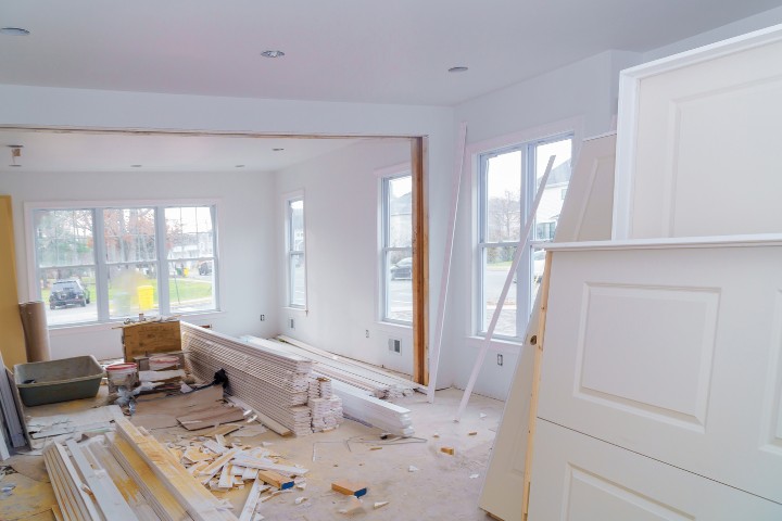 Home addition construction transforming basement into living quarters