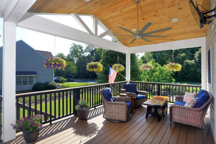 Outdoor deck home addition with modular seating and coffee table
