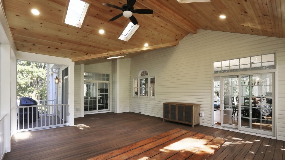 indoor outdoor flow home addition Indoor-outdoor transition space featuring recessed lights and fan
