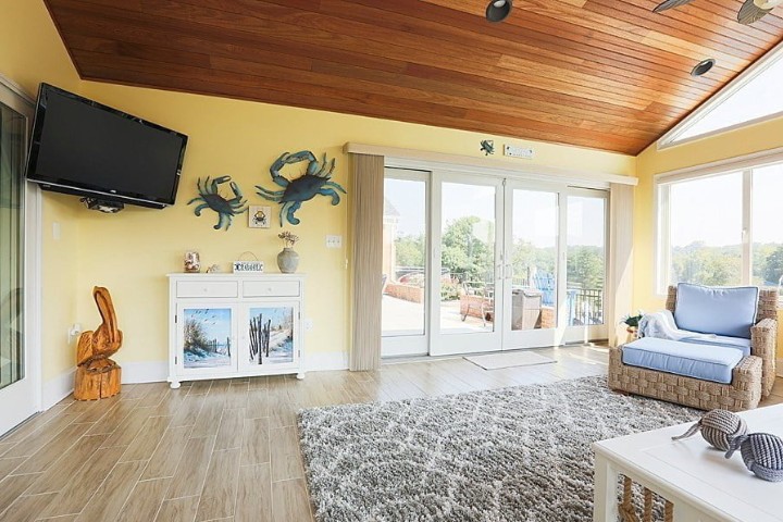 Large glass doors connecting indoor living space to patio