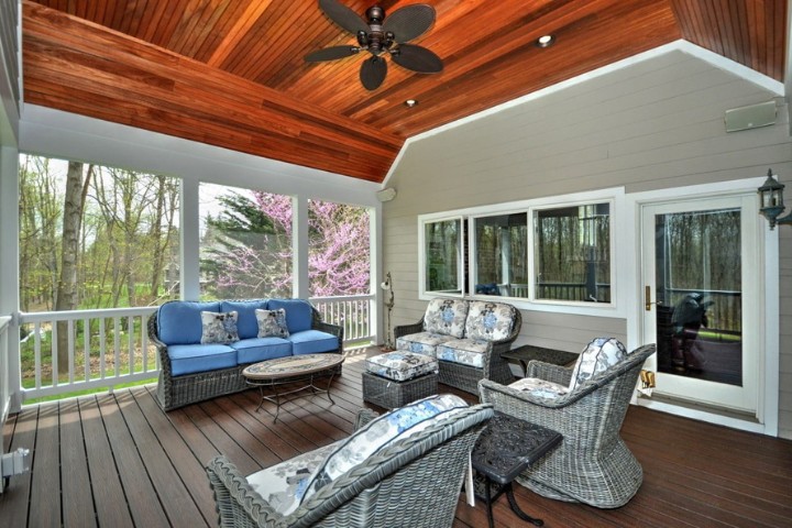 Enclosed deck with comfortable seating for outdoor enjoyment