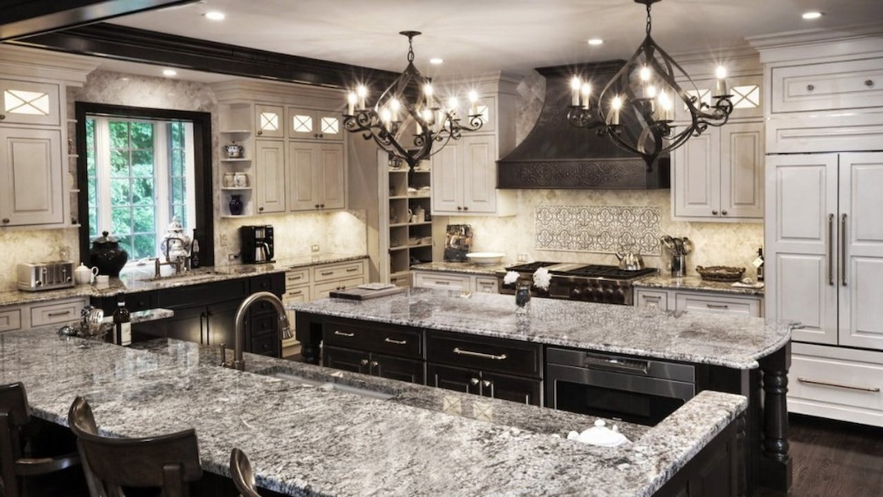 Classic kitchen interior design in Maryland featuring granite countertops and chandeliers