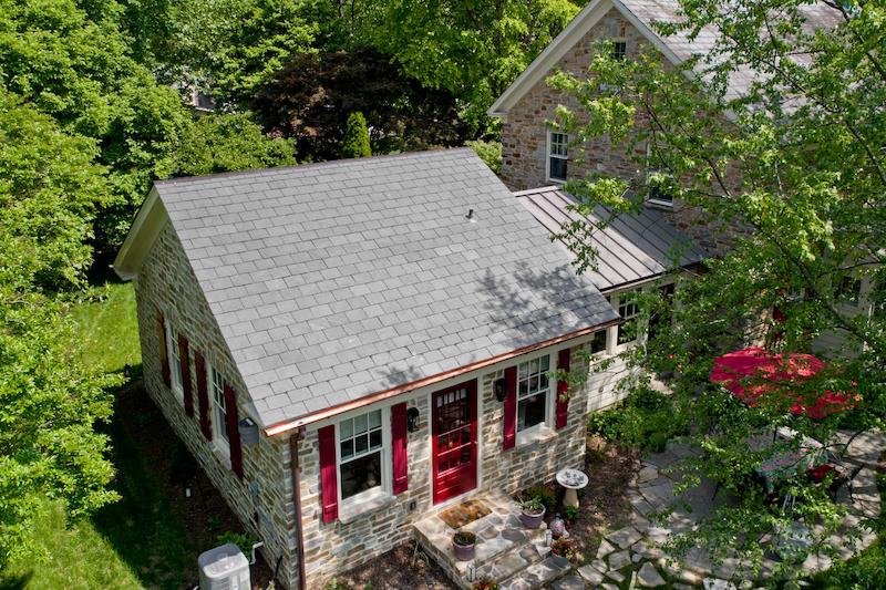 In-law apartment home addition in Maryland featuring stone exterior and red accents
