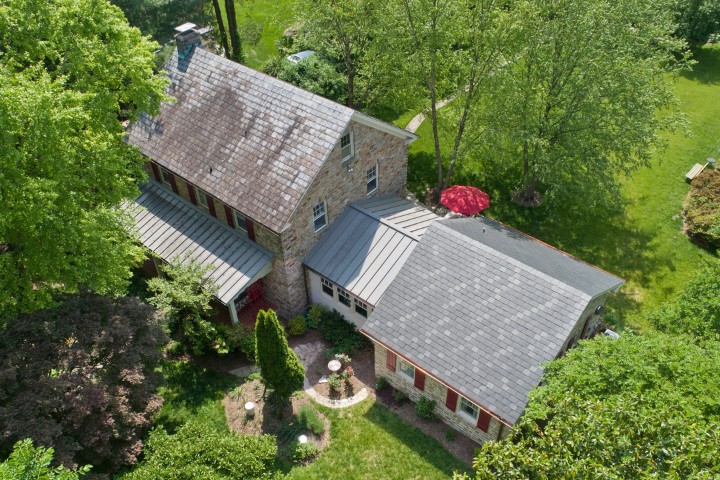 Expanded stone home addition enhancing property value and design harmony