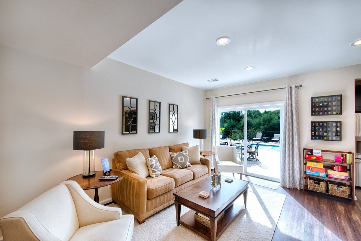 bright living room renovation with cozy seating and outdoor patio access