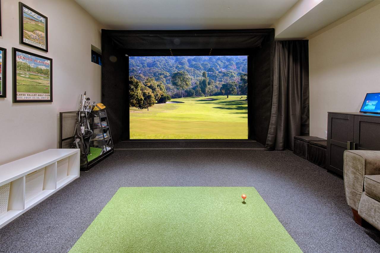 Garage conversion in Maryland transformed into a modern indoor golf simulator room