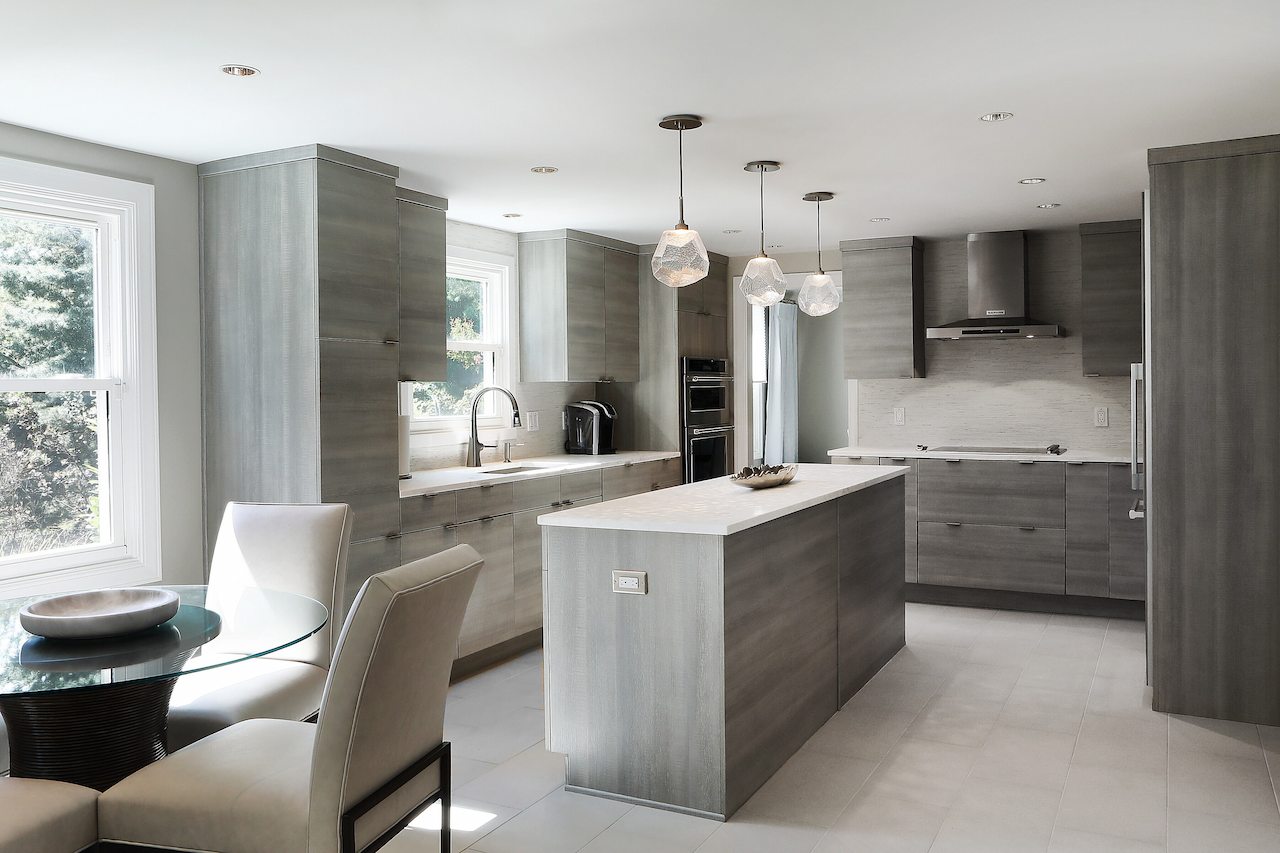 Minimalist kitchen renovation with flat-panel cabinets and neutral finishes in Anne Arundel County
