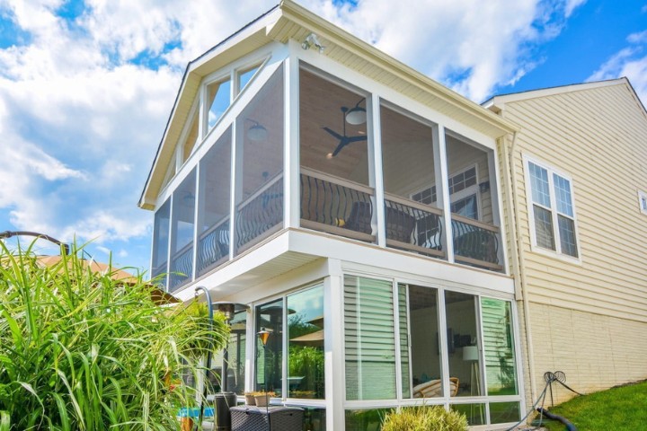 Exterior of a two-story sunroom addition enhancing indoor-outdoor living in a Maryland home