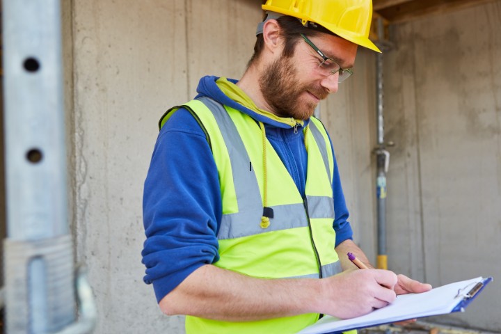 Contractor inspecting a historic home for remodeling or renovation