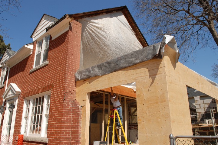 Home Remodel addition in progress on a brick Maryland home