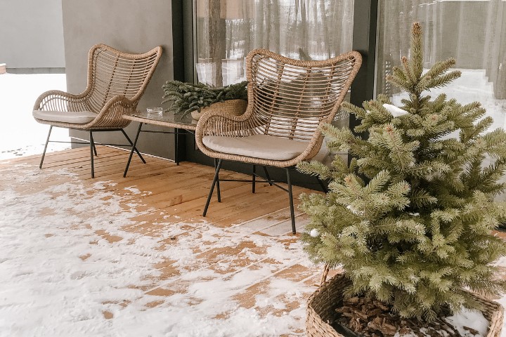 Outdoor seating area surrounded by snow, illustrating the benefit of enclosed sunroom additions in Delaware, Pennsylvania, and Maryland