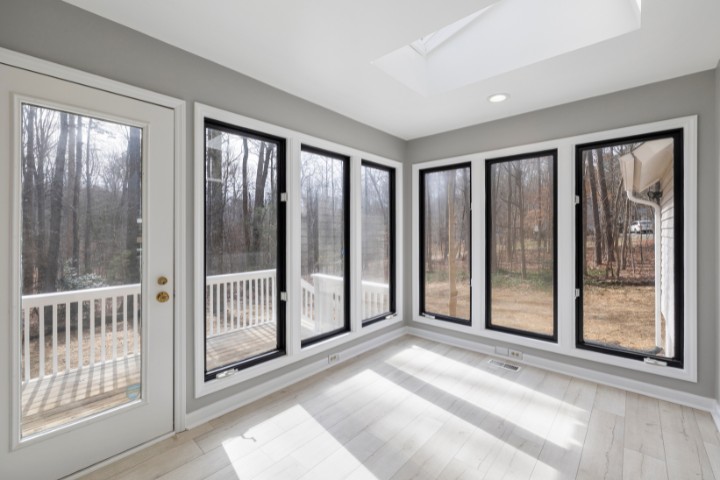 Spacious four-season sunroom with panoramic glass walls that maximize natural light and warmth during cold season in MD PA and DE