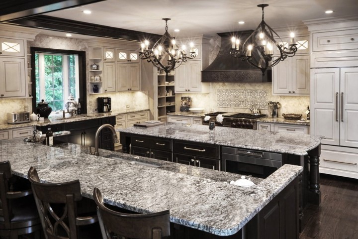 Classic luxury Maryland kitchen with marble countertops, chandeliers, and custom cabinetry