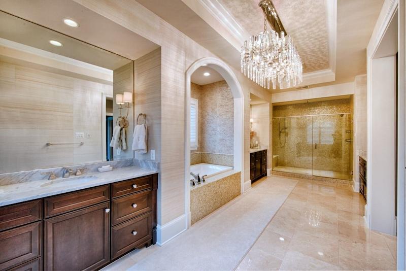 luxury howard county bathroom remodeling project featuring marble floors and elegant chandelier lighting