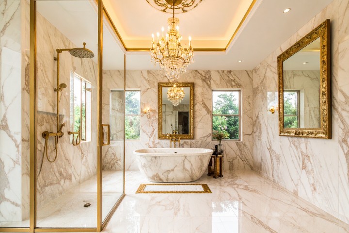 Elegant bathroom remodel with marble finishes and chandelier home decor for a sophisticated timeless look