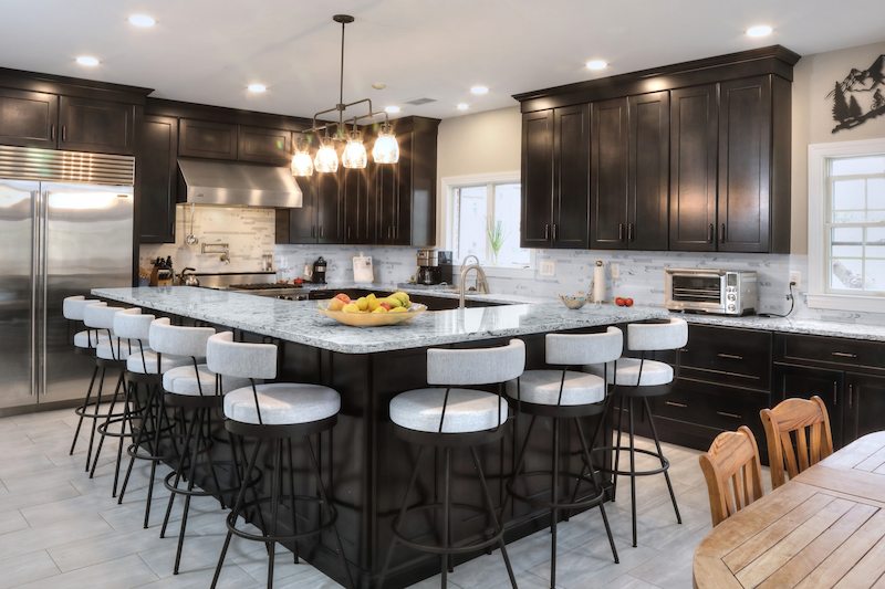 beautifully remodeled kitchen with rich cabinetry bright countertops and ample seating throughout this baltimore county home