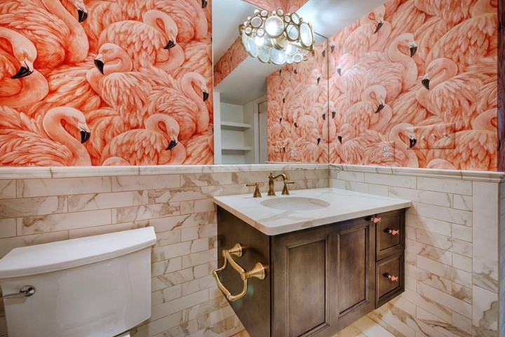 Luxury bathroom remodel featuring bold flamingo wall design and marble finishes blending classic and modern style