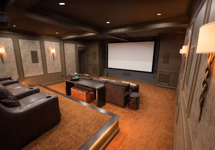 Basement renovation trend featuring a modern home cinema with recliners