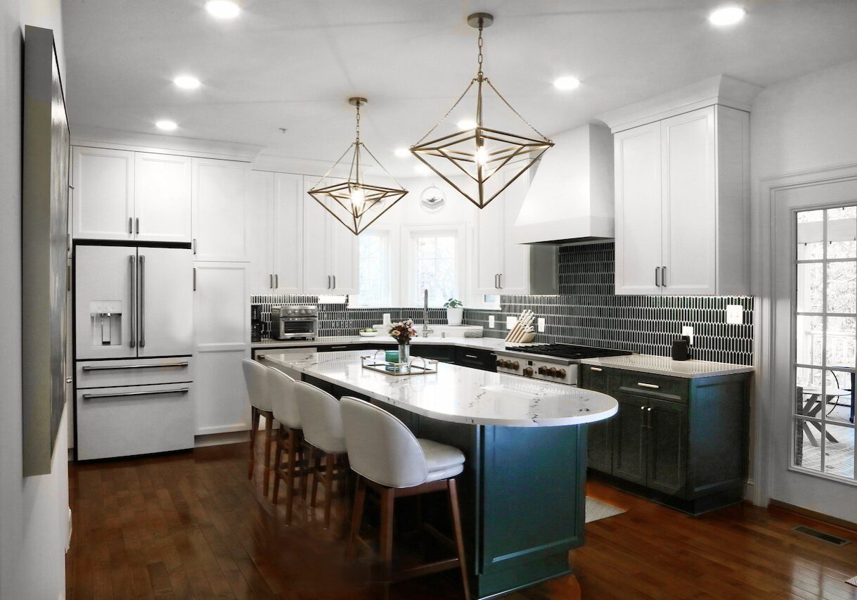 elegant kitchen renovation featuring a marble island and geometric lighting