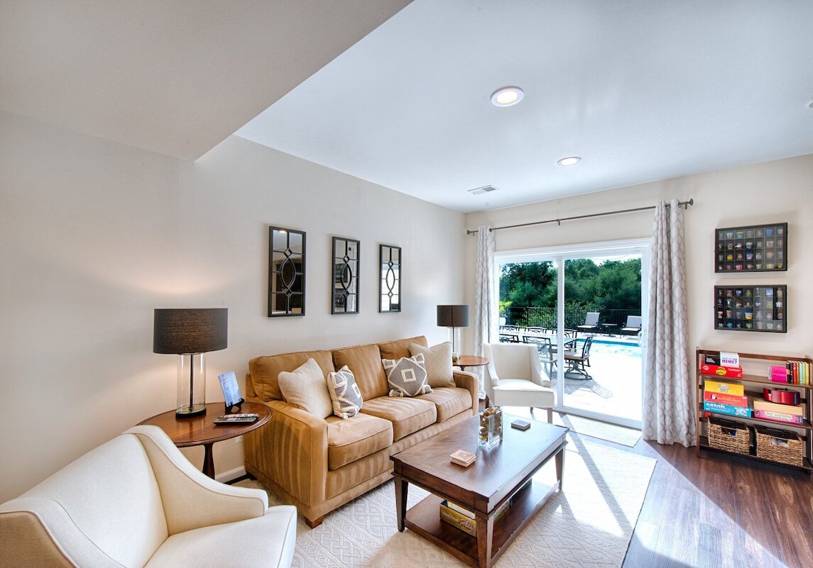 bright living room renovation with cozy seating and outdoor patio access